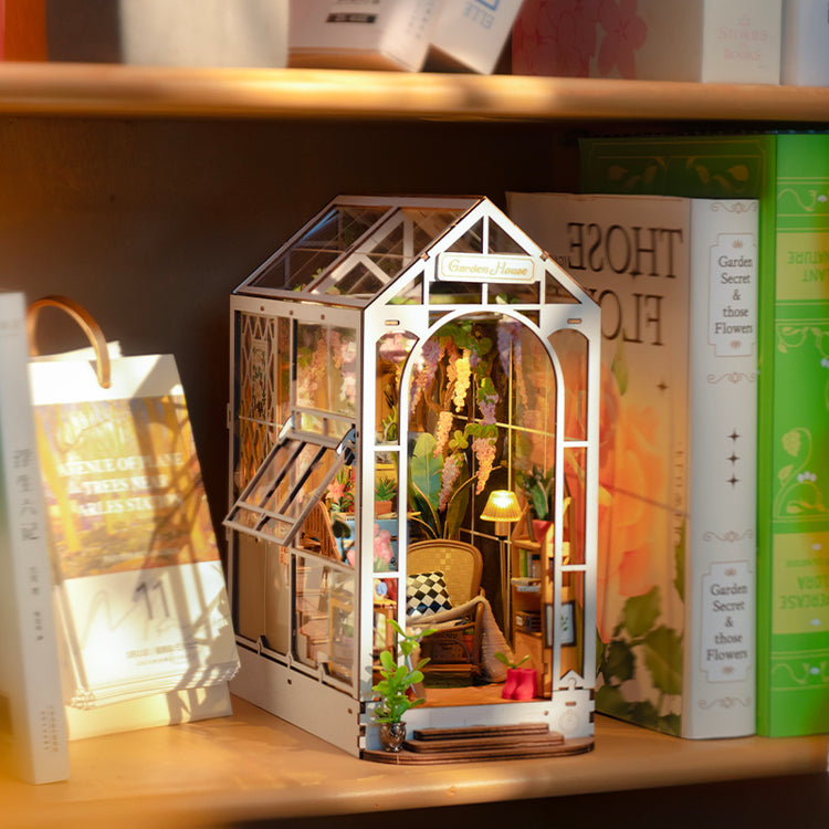a miniature house on a shelf