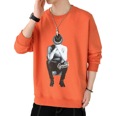 a person wearing an orange sweatshirt with a picture on it