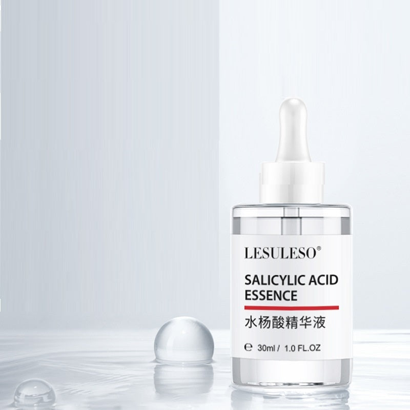 a bottle of liquid with a dropper