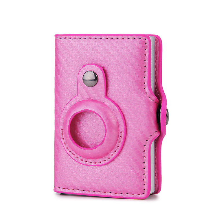a pink leather wallet with a ring