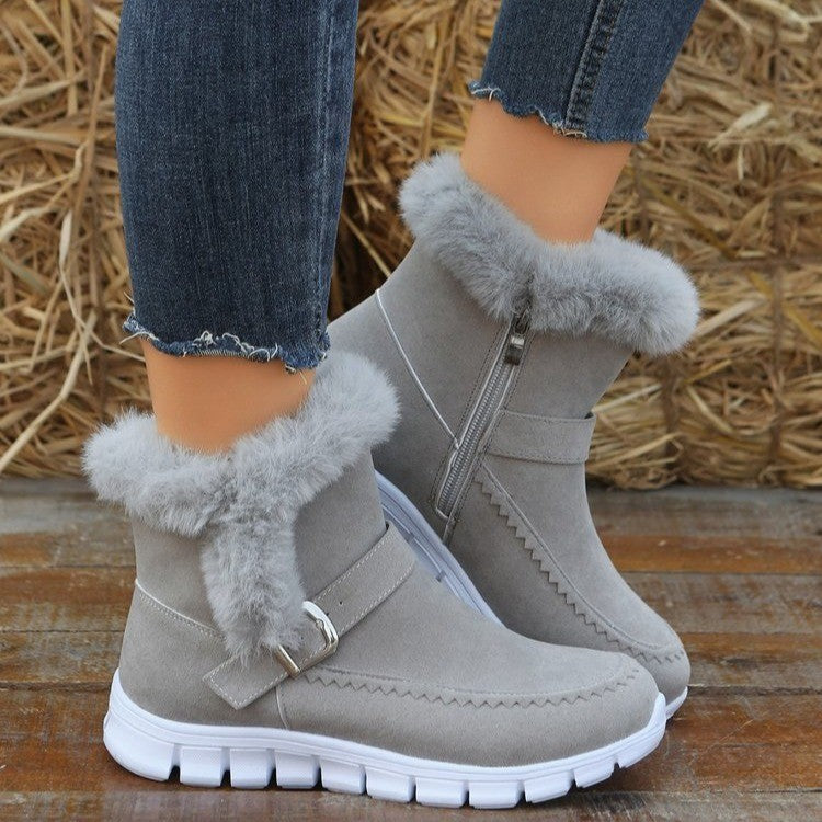 a person wearing grey boots