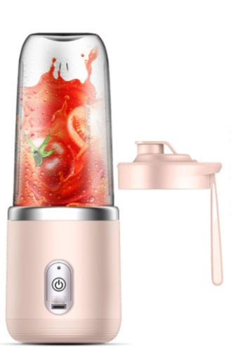 a blender with a tomato in it