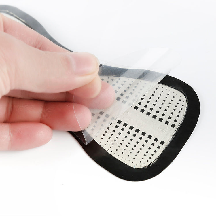 a person holding a transparent patch
