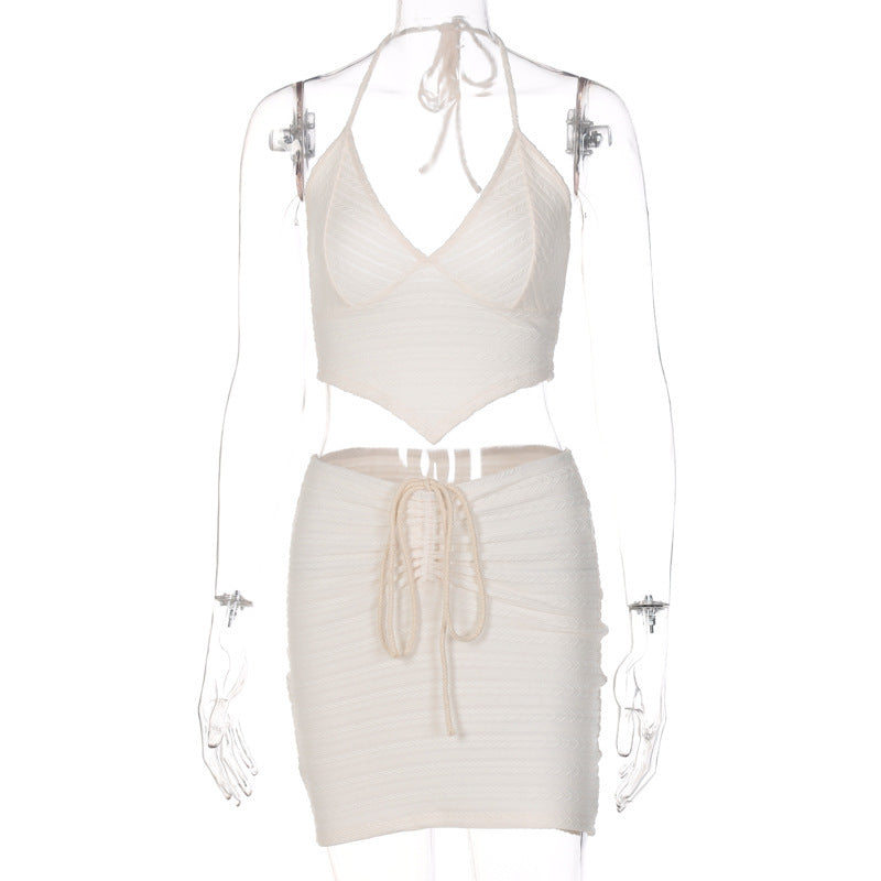a mannequin wearing a white outfit