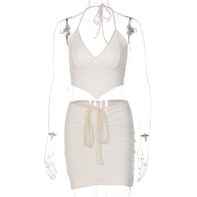 a mannequin wearing a white outfit