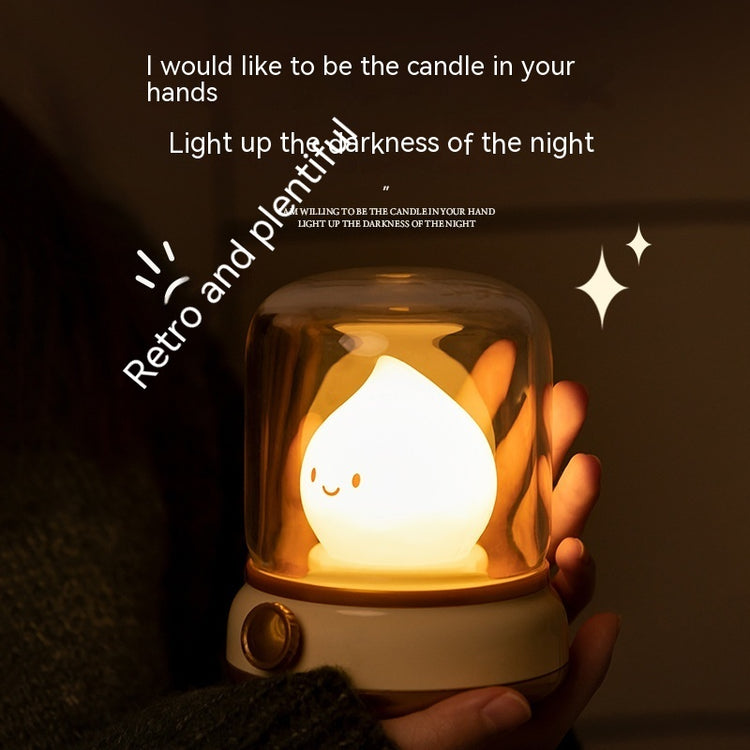 a hand holding a small light