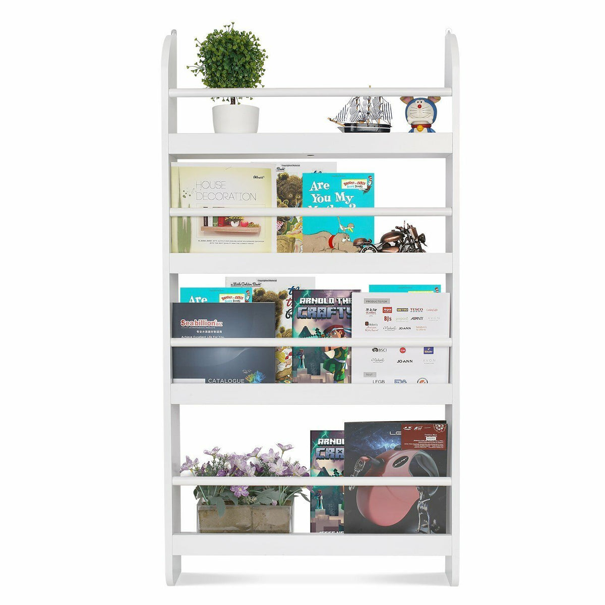 a white shelf with books and a plant