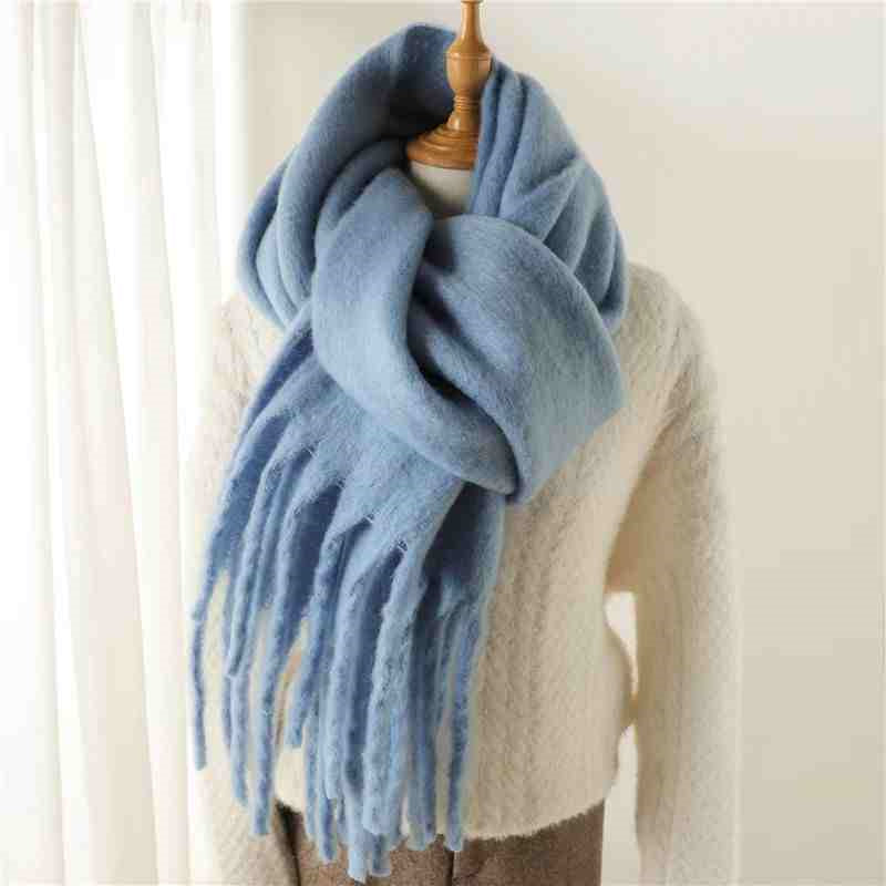 a blue scarf on a mannequin