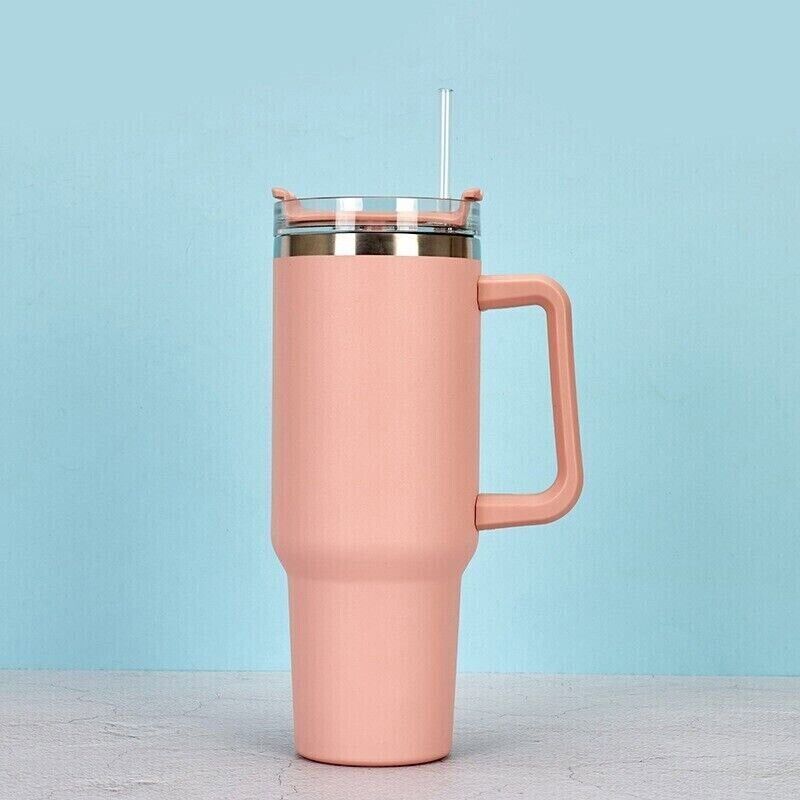 a pink mug with a straw