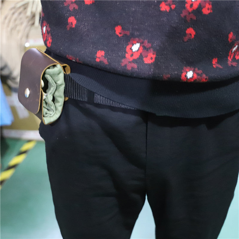 a person wearing a belt with a purse in it