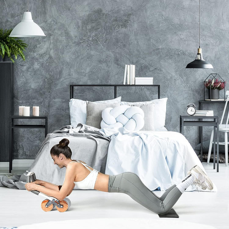 a woman doing push ups in a bedroom