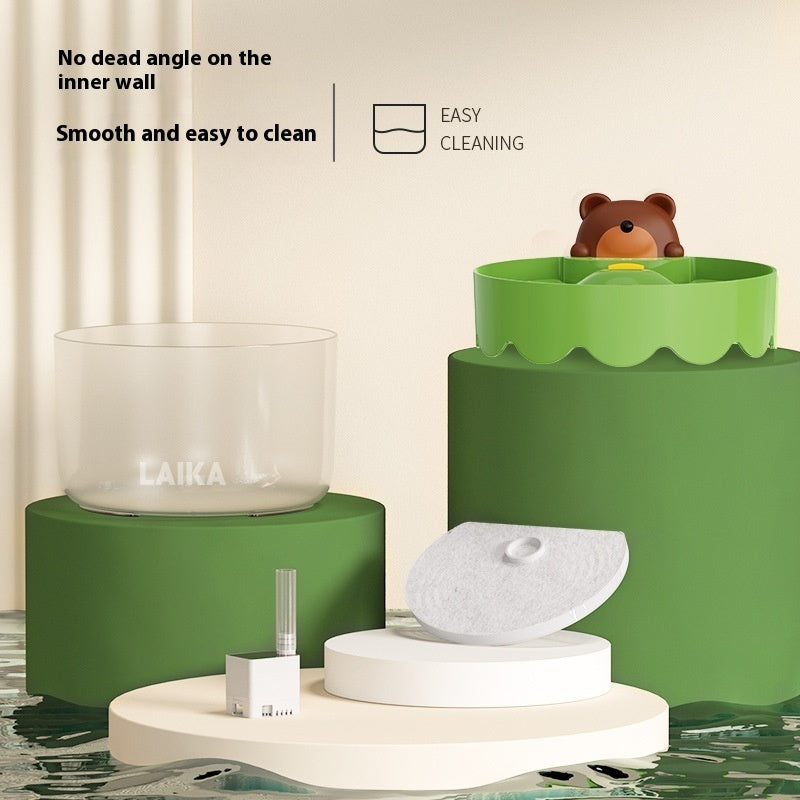 a green and white pedestals with a teddy bear in it