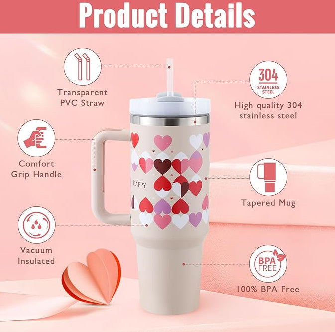 a white and pink coffee mug with a straw and hearts on it