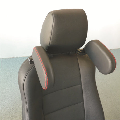 a black leather seat with red stitching