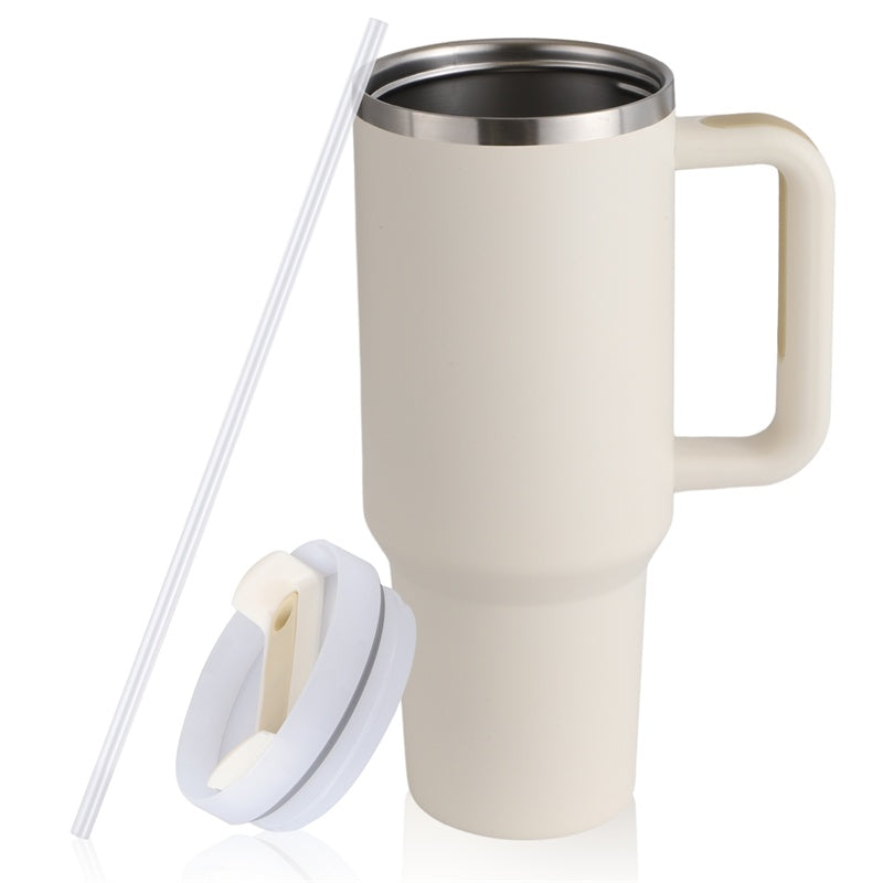 a white coffee mug with a straw