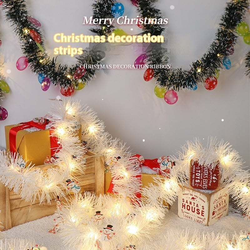 a group of boxes with presents and garlands