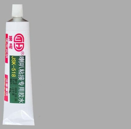 a white tube with red and green text