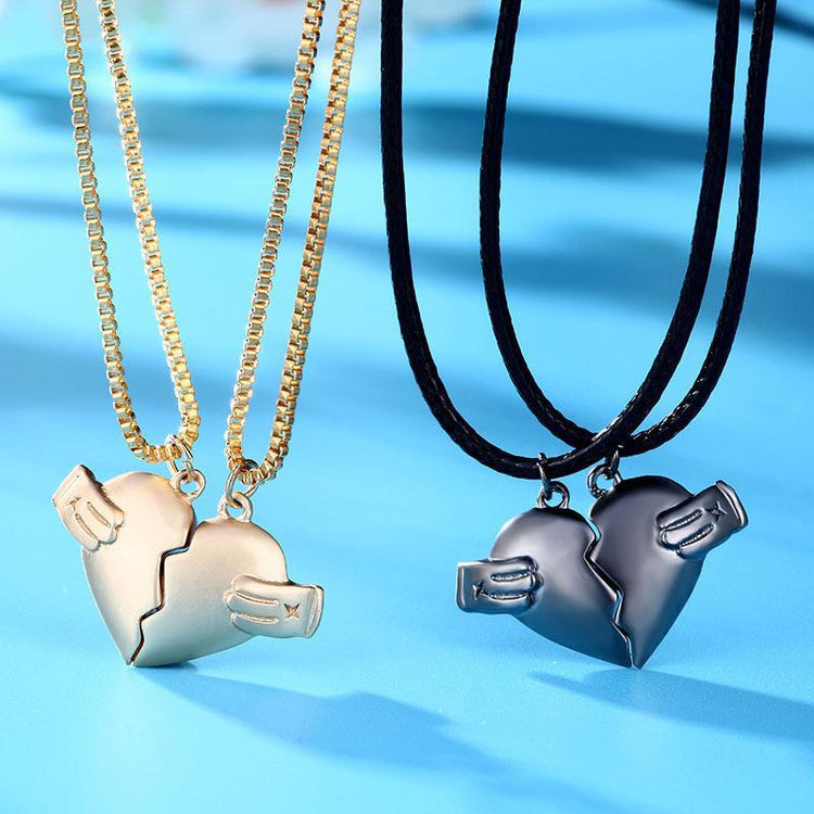 a couple of necklaces with a broken heart