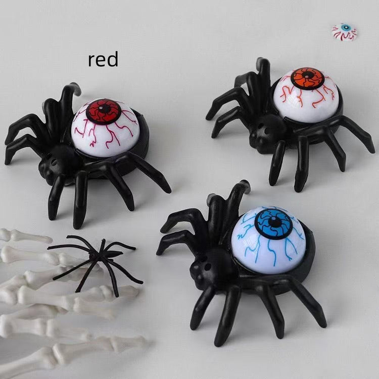 a group of plastic spiders with eyes and bones