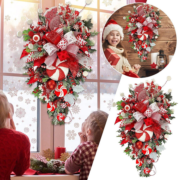 a group of people looking at a christmas decoration