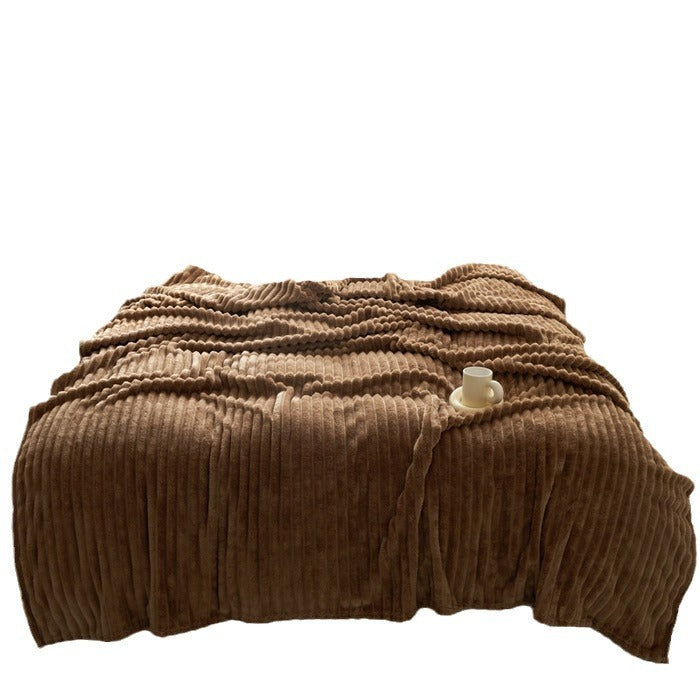 a brown blanket with a cup on it