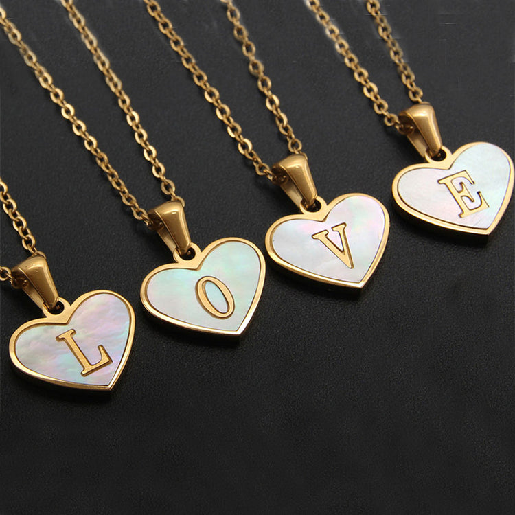 a row of necklaces with heart shaped pendants
