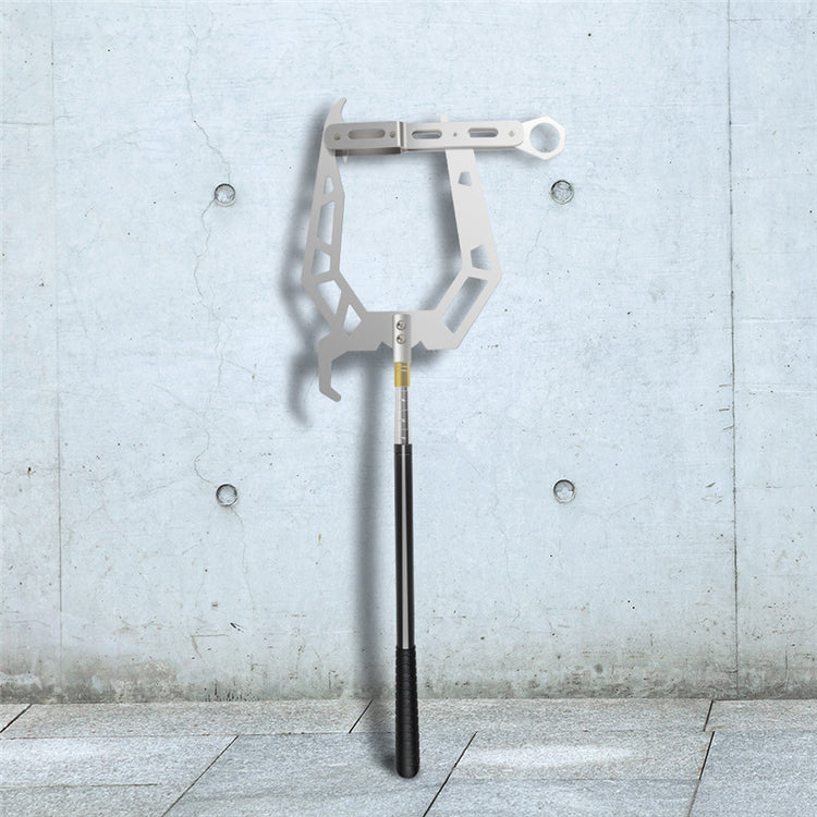 a metal tool on a stick