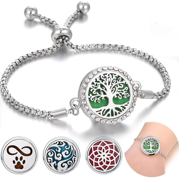 a silver bracelet with a green and blue circle with a dog paw and a green and blue circle with a green circle with a green circle with a white circle with a black circle with a white circle