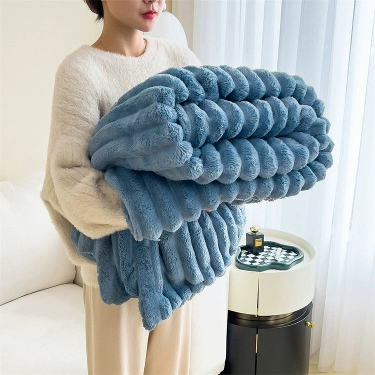 a woman holding a blue blanket