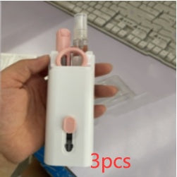 a hand holding a device