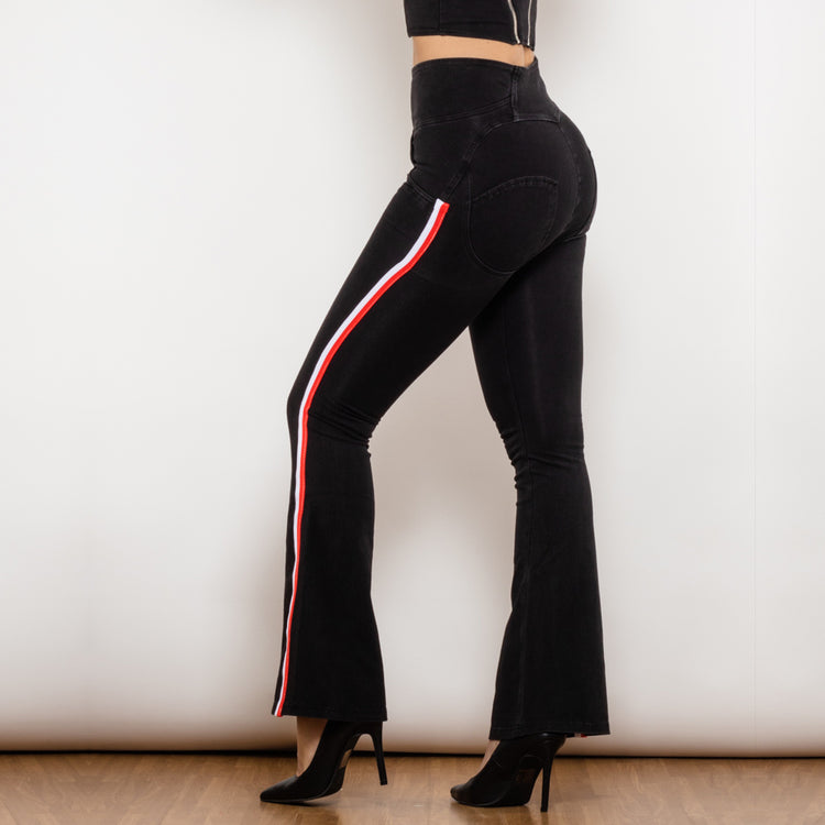 a woman wearing black pants and high heels