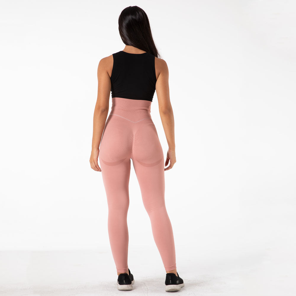 a woman in pink tights