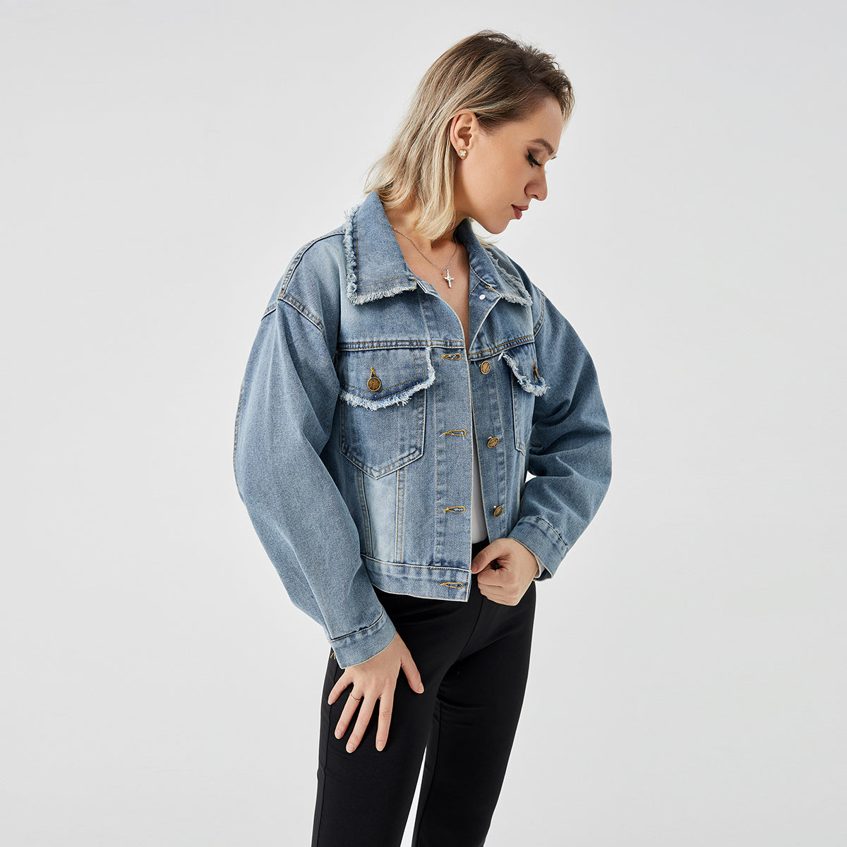 a woman in a denim jacket