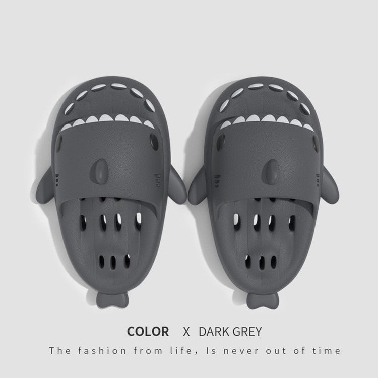a pair of slippers with shark shaped faces