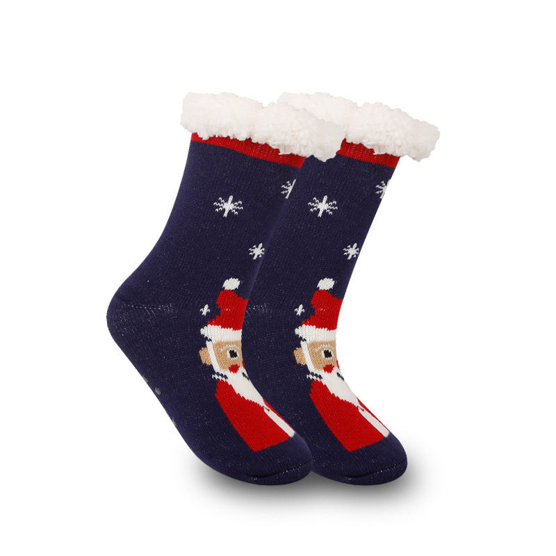 a pair of blue and red socks with a santa claus on it