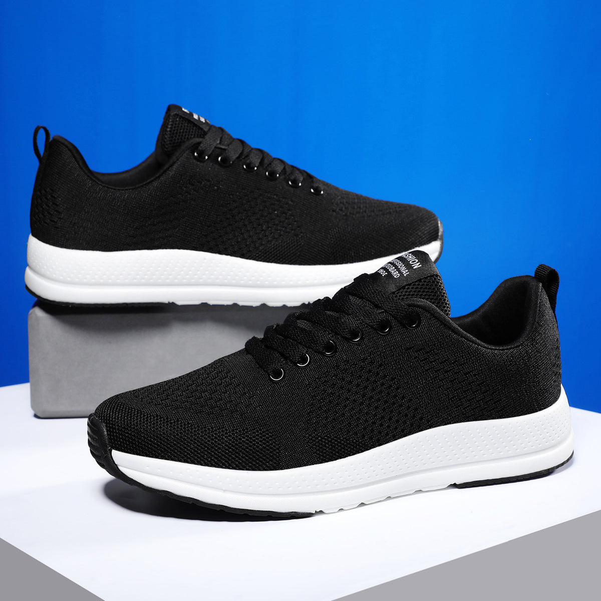a pair of black and white sneakers